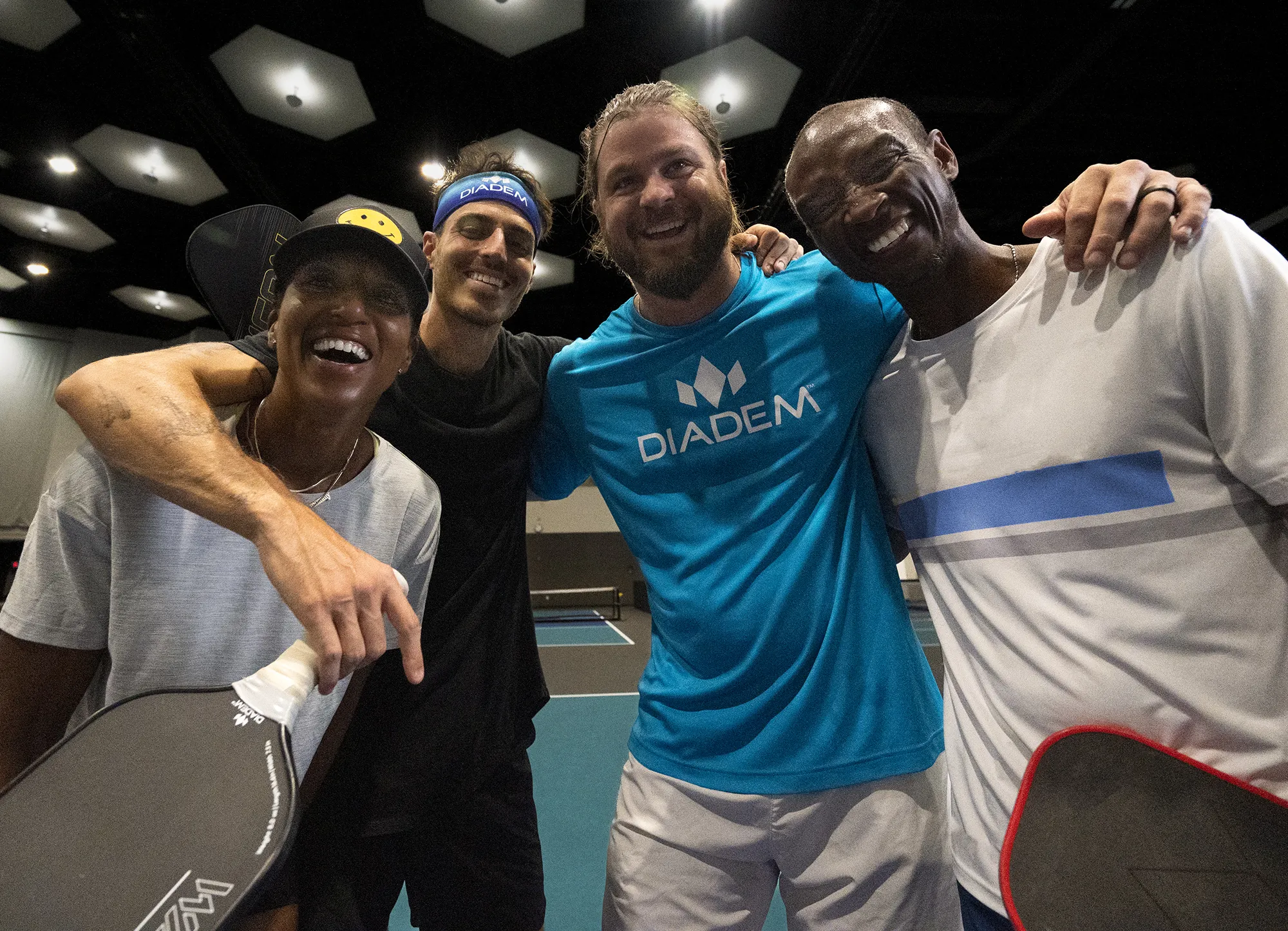 Players celebrating together after a match with Diadem paddles